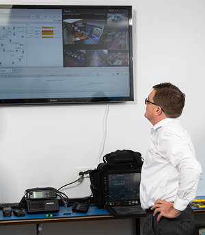 Comtel team member inspecting CCTV system