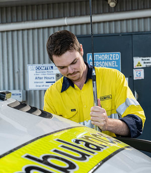 Comtel team member fixing antenna on Ambulance